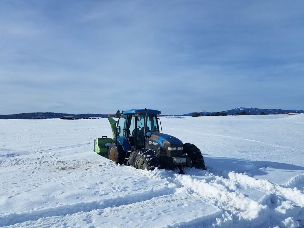 The tractor is stuck in the snow